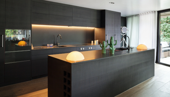 Warm white in black themed kitchen